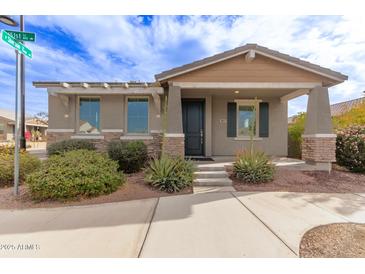 Single-story home with front porch and landscaping at 815 S 151St Ln, Goodyear, AZ 85338