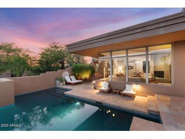 Stunning pool and patio area with seating at 10758 E Tamarisk Way, Scottsdale, AZ 85262