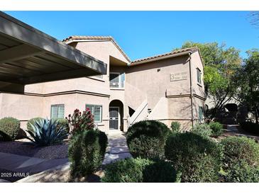 Building exterior with landscaping and walkway at 15050 N Thompson Peak Pkwy # 1010, Scottsdale, AZ 85260