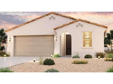 One-story home with Spanish-style architecture, two-car garage, and landscaped front yard at 1730 S 246Th Ln, Buckeye, AZ 85326