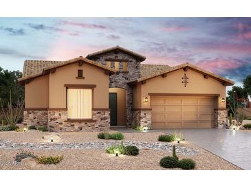 Beautiful stucco home with stone accents and a two-car garage at 20110 W San Juan W Ave, Litchfield Park, AZ 85340