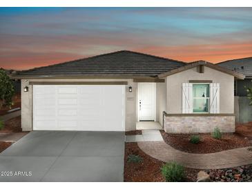 One-story home with a two-car garage and landscaped front yard at 20775 N Roadrunner Ln, Maricopa, AZ 85138