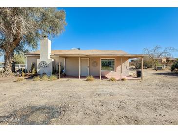 Ranch house with covered porch and large yard at 26207 S Lime Dr, Queen Creek, AZ 85142