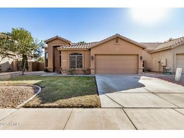 House exterior showing a well-maintained lawn and a two-car garage at 2673 W Ivanhoe St, Chandler, AZ 85224