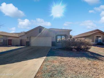 Single-story home with attached garage and desert landscaping at 3057 E Superior Rd, San Tan Valley, AZ 85143