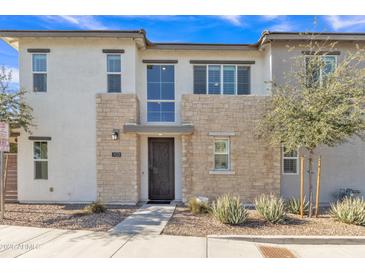 Two-story home with stone accents and a modern front door at 755 E Zion Dr # 103, Gilbert, AZ 85297