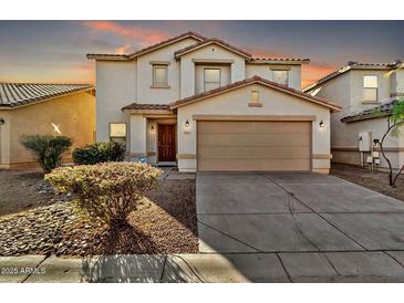 Two-story house with a two-car garage and landscaping at 8851 E Pampa Ave, Mesa, AZ 85212