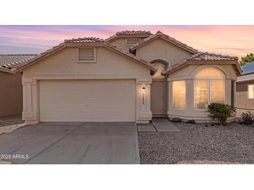 Well-maintained single-story home with a two-car garage at 11670 W Pine Mountain Ct, Surprise, AZ 85378