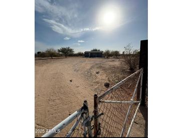 Single-wide manufactured home with a spacious yard at 13705 S 209Th Ave, Buckeye, AZ 85326