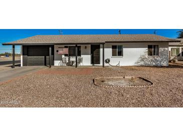 Cute single story home with a carport and small front yard at 1510 E Ironwood Dr, Buckeye, AZ 85326