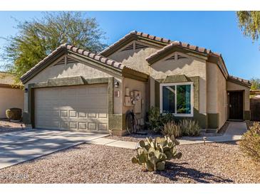 Single-story house with a two-car garage and desert landscaping at 2135 N St Pedro Ave, Casa Grande, AZ 85122