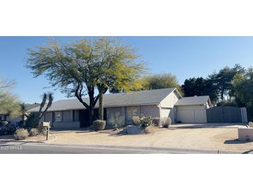 Brick ranch house with desert landscaping and a two-car garage at 2935 W Kristal Way, Phoenix, AZ 85027