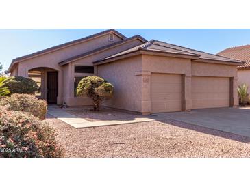 Two-car garage and attractive landscaping enhance this charming home's curb appeal at 3403 E Wyatt Way, Gilbert, AZ 85297