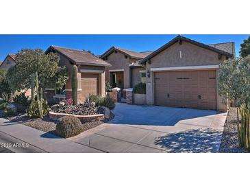 Single-story home with desert landscaping and two-car garage at 3649 N Hudson Dr, Florence, AZ 85132