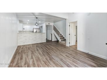 Bright living room with wood-look floors and an open layout at 4608 W Maryland Ave # 125, Glendale, AZ 85301