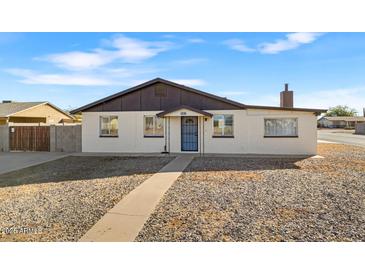 Charming single-story home with a well-maintained front yard and walkway at 9163 W Swansea Dr, Arizona City, AZ 85123