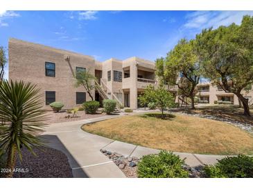 Condo building with landscaped grounds and walkway at 14645 N Fountain Hills Blvd # 205, Fountain Hills, AZ 85268