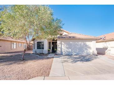 One-story home with a two-car garage and landscaped front yard at 5226 S 15Th St, Phoenix, AZ 85040