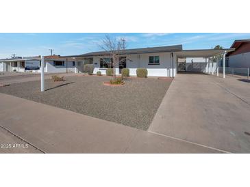 Charming single story home with well-maintained front yard and driveway at 5490 E Boise St, Mesa, AZ 85205