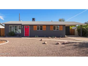 Charming ranch-style home with red door and modern updates at 2101 N Normal Ave, Tempe, AZ 85288