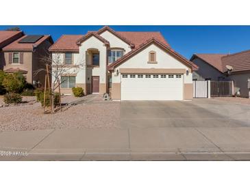 Two-story house with a large garage and landscaped yard at 2442 E Winged Foot Dr, Chandler, AZ 85249
