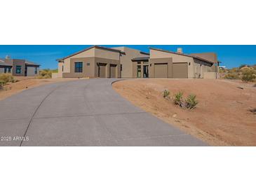 Modern desert home with two-car garage and expansive driveway at 25572 N 119Th St, Scottsdale, AZ 85255