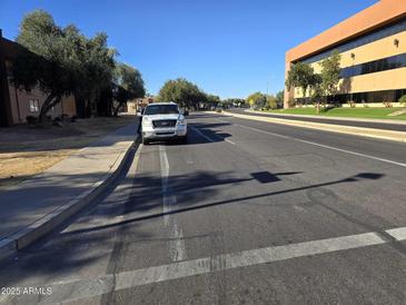 Street view of the property, showing a quiet neighborhood at 3810 N Maryvale Pkwy # 1093, Phoenix, AZ 85031
