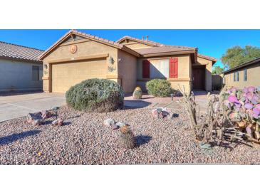 One-story home with desert landscaping and a two-car garage at 19572 N Sandalwood Dr, Maricopa, AZ 85138