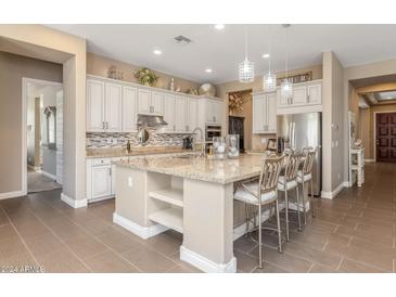 Spacious kitchen with island and stainless steel appliances at 10550 E Sanger Ave, Mesa, AZ 85212