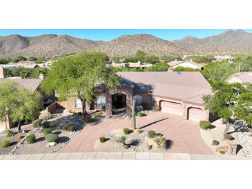 Luxury home with desert landscaping and mountain views at 12238 E Poinsettia Dr, Scottsdale, AZ 85259