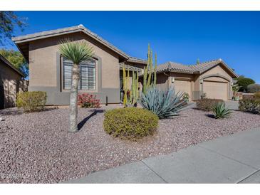 Single-story home with desert landscaping and two-car garage at 26646 N 46Th Pl, Cave Creek, AZ 85331