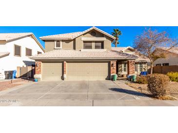 Two-story house with a two-car garage and well-maintained landscaping at 544 W Sierra Madre Ave, Gilbert, AZ 85233