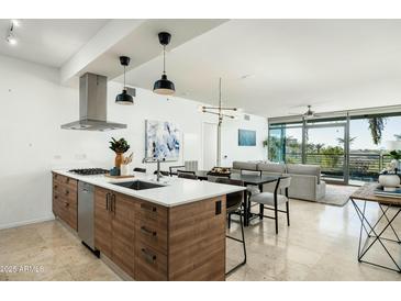 Modern kitchen with stainless steel appliances and an island at 7120 E Kierland Blvd # 311, Scottsdale, AZ 85254