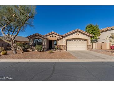 Single-story home with desert landscaping and two-car garage at 7432 E Melrose St, Mesa, AZ 85207