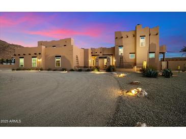 Stunning Southwestern-style home with a large front yard at 9255 W Buckskin Trl, Peoria, AZ 85383