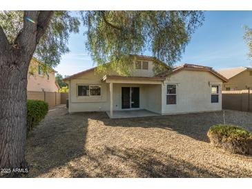 Large backyard with gravel and covered patio at 15144 W Washington St, Goodyear, AZ 85338