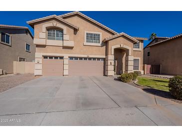 Two-story house with a large driveway and landscaping at 2734 E Birchwood Pl, Chandler, AZ 85249