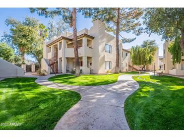 Attractive exterior of a condo building with lush landscaping and walkways at 750 E Northern Ave # 1053, Phoenix, AZ 85020