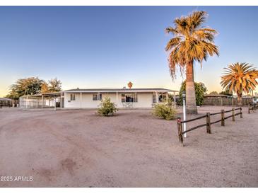 Single-story home with carport and desert landscaping at 816 S Esperanza Ave, Mesa, AZ 85208