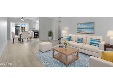 Bright living room with light beige sofa and wood coffee table at 17242 N 16Th Dr # 9, Phoenix, AZ 85023