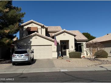 Two-story house with a landscaped yard and attached two-car garage at 1878 E Oasis Dr, Tempe, AZ 85283