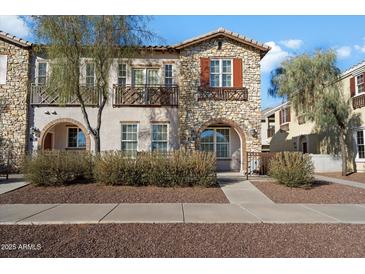 Two-story townhome with stone exterior and private entrance at 2757 S Pewter Dr # 103, Gilbert, AZ 85295