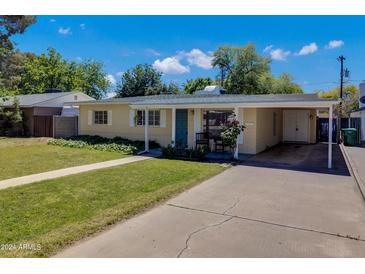 House exterior showcasing a covered carport and front yard at 303 W 9Th St, Mesa, AZ 85201