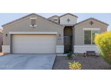 One-story house with a two-car garage and desert landscaping at 30905 W Fairmount Ave, Buckeye, AZ 85396