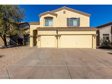 Two-story house with a three-car garage and desert landscaping at 3482 W Mineral Butte Dr, San Tan Valley, AZ 85144