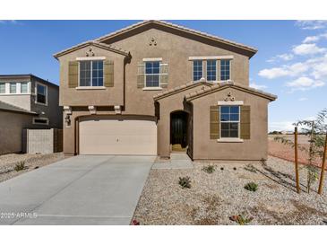 Two-story house with a large garage and neutral exterior at 37536 W Patterson St, Maricopa, AZ 85138