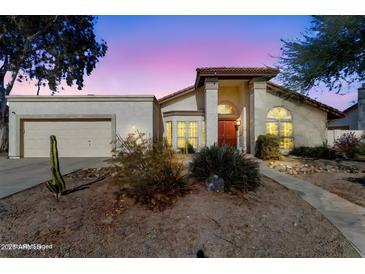 Attractive single-story home with desert landscaping and a two-car garage at 408 W Straford Dr, Chandler, AZ 85225