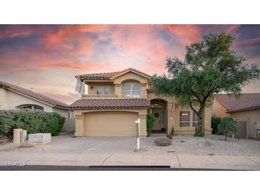 Beautiful two-story home with desert landscaping and a three-car garage at 4417 E Rancho Caliente Dr, Cave Creek, AZ 85331