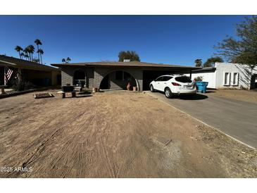 Ranch style home with carport and mature landscaping at 7320 N 29Th Ave, Phoenix, AZ 85051
