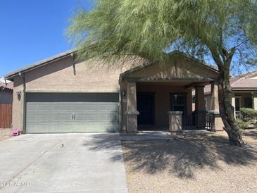 One-story house with a two-car garage and covered porch at 42554 W Lucera Ct, Maricopa, AZ 85138